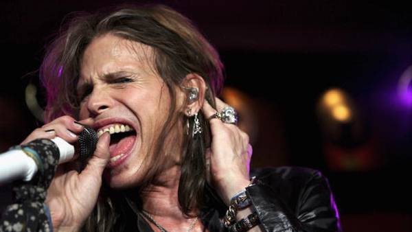 Steven Tyler takes the stage for the first time since his throat problems.
